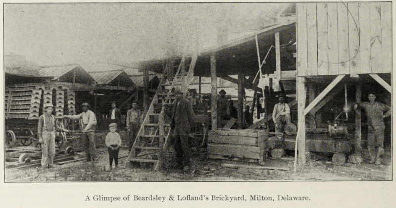 This photograph appeared in The Clay-Worker publication in the early 1900s. It shows the Beardsley and Lofland Brickyard. Both R.C. Beardsley and Alfred Lofland appear in the photo. Beardsley stands at the bottom of the stairs, while Lofland is seen to the right with his foot resting on the engine. SOURCE: THE CLAY-WORKER